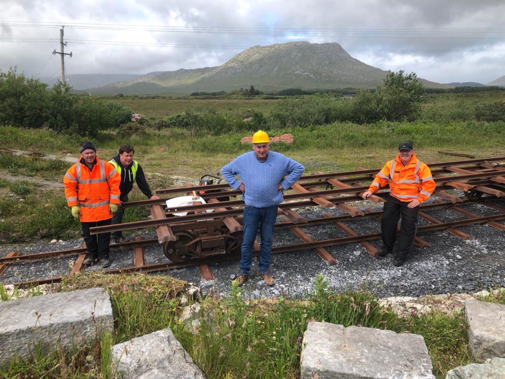 Happy volunteers moving rail panels to the railhead – very satisfying work!