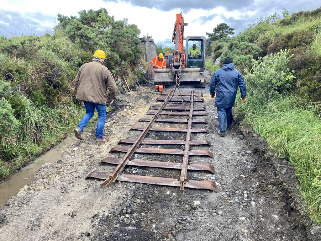 The last of the temporary track is lowered into position. 